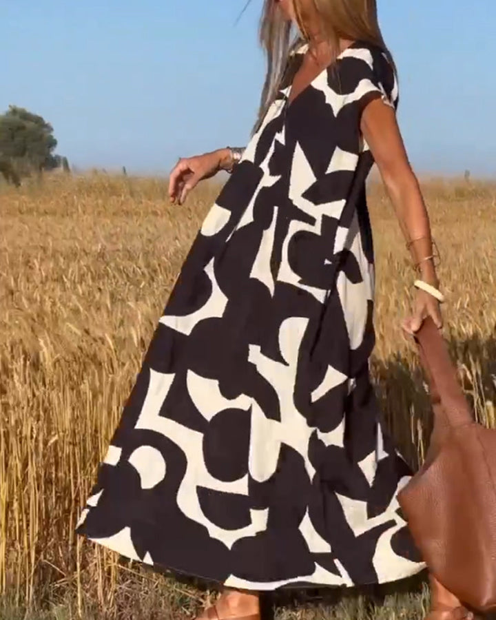 SITA - Dress with print and V-neckline